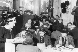 Customers_enjoying_afternoon_tea_at_Lyon's_Corner_House_on_Coventry_Street,_London,_1942._D6573